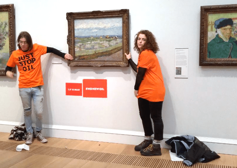 activists-glue-themselves-to-van-gogh-art-to-protest-climate-change-apathy.png